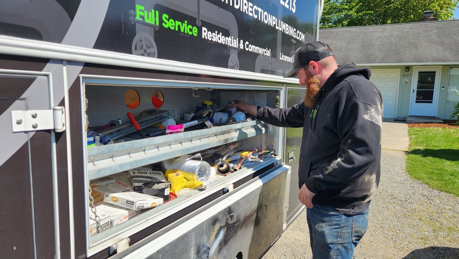 Right Direction Plumbing plumber working from a stocked service truck